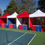 Outdoor carnival event red and white tents